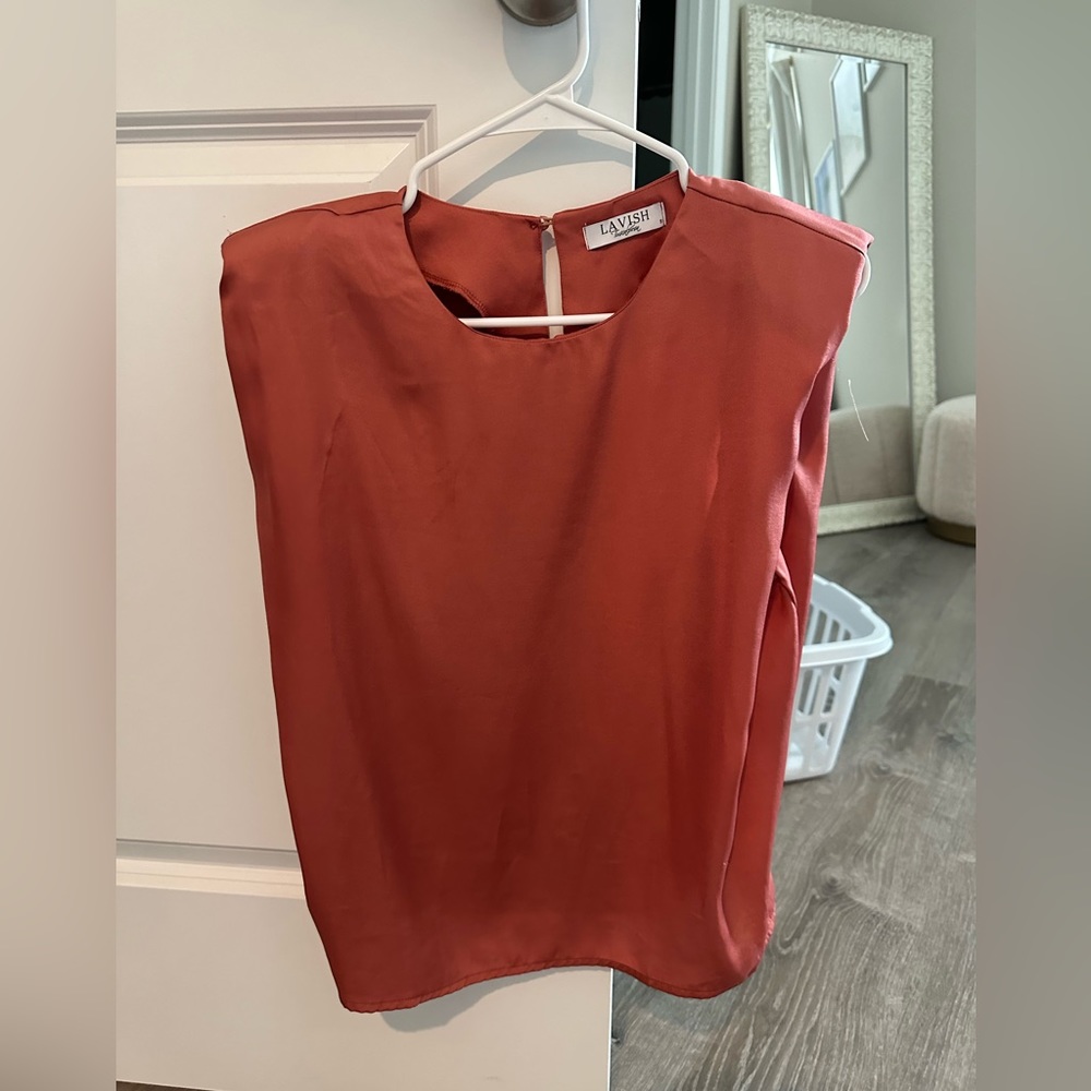 sleeveless top with shoulder pads